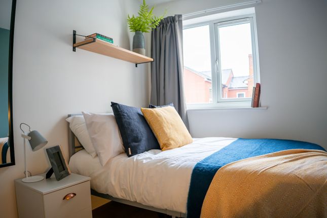 A Stylish And Inviting Double Bedroom With Ample N...