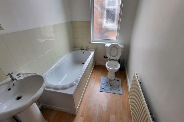 A Clean And Bright Bathroom Featuring A Full-Sized...