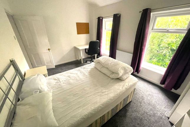 A Bright And Inviting Double Bedroom With Ample Na...