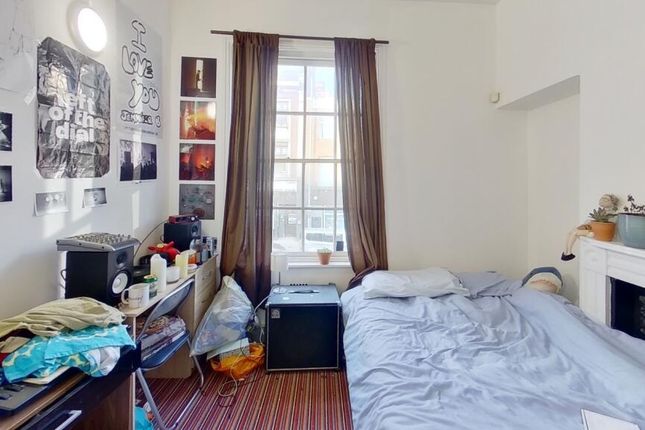 A Bright And Inviting Master Bedroom Featuring A l...