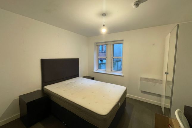 A Neat And Simple Double Bedroom Featuring A Comfo...