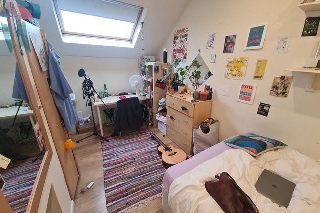 Cozy Single Bedroom Featuring A Comfortable Bed, A...