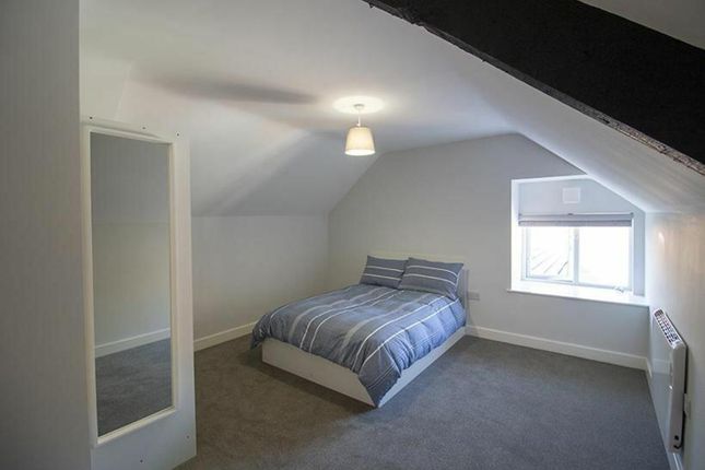 This Inviting Double Bedroom Features A Cozy Desig...