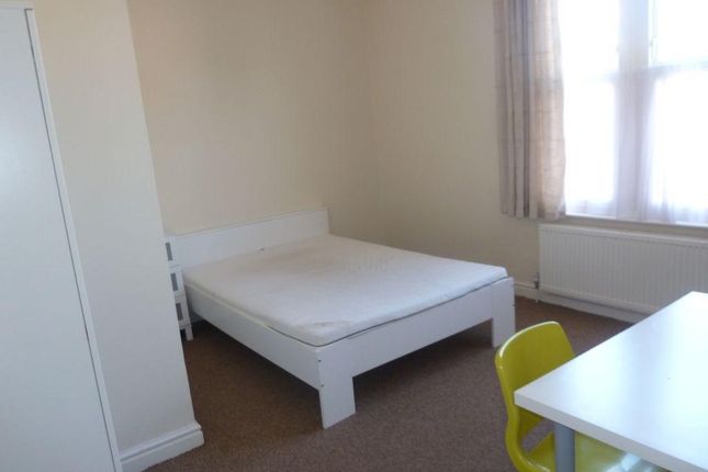 A Bright And Tidy Double Bedroom Featuring A White...