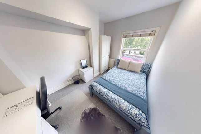 A Bright And Tidy Double Bedroom Featuring A Comfo...