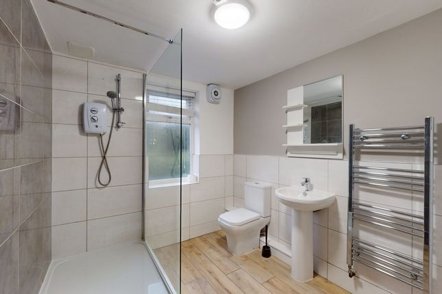A Modern And Clean Bathroom Featuring A Spacious S...