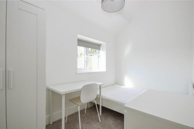 A Bright And Modern Double Bedroom With A Desk And...