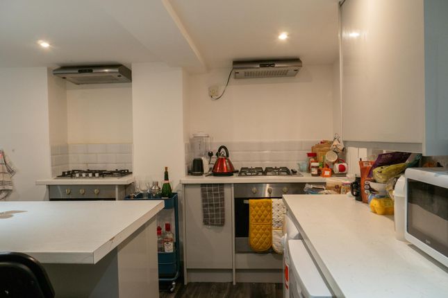Modern And Well-Equipped Kitchen With Ample Counte...