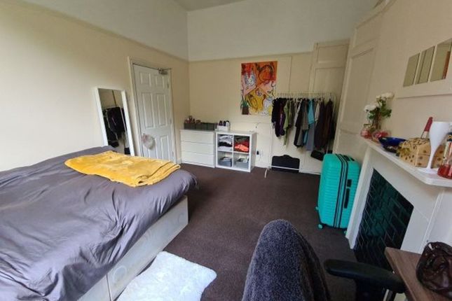 A Cozy Double Bedroom Featuring A Comfortable Bed ...