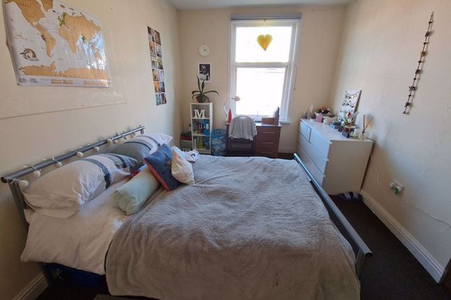 A Spacious Master Bedroom Featuring A Double Bed W...