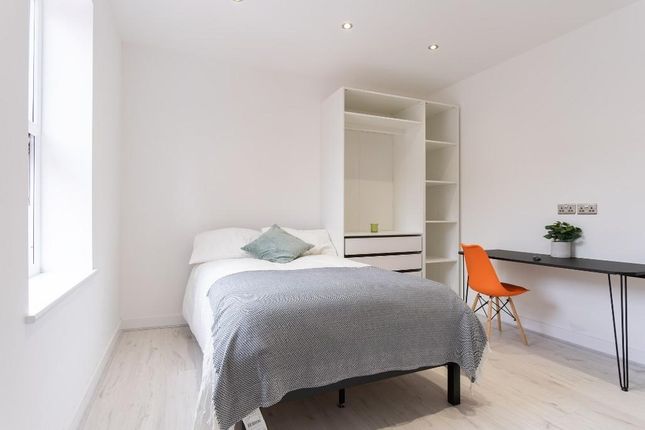A Bright And Inviting Double Bedroom Featuring A c...