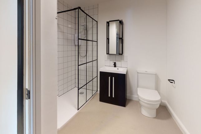 Modern Bathroom Featuring A Walk-In Shower With Bl...
