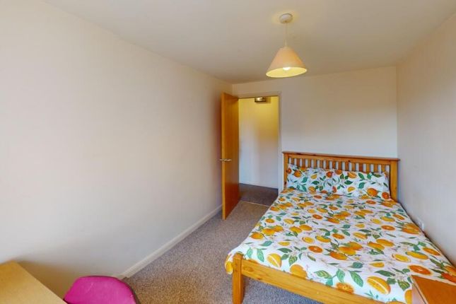 A Well-Maintained Bedroom Featuring A Cozy Single ...