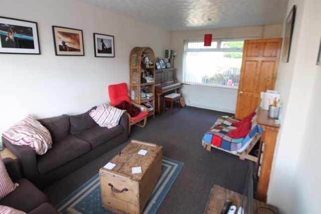 A Cozy Living Room Featuring A Comfortable Sofa, A...