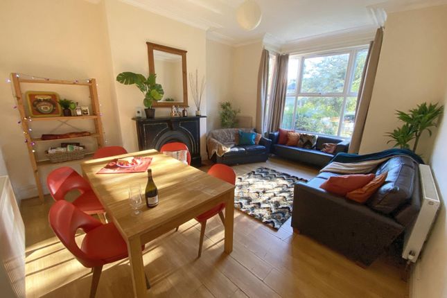 Bright, Well-Furnished Living Room With A Large Fr...