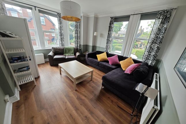 Bright And Welcoming Living Room Featuring Large W...