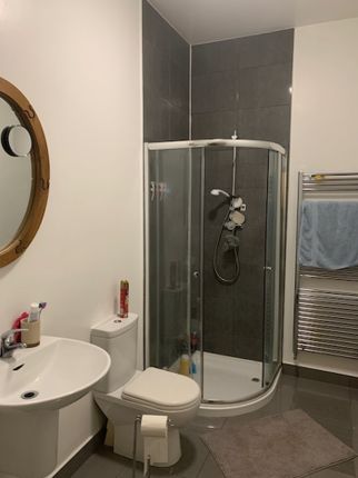 A Modern Bathroom Featuring A Sleek Shower And Con...