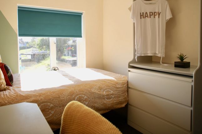 A Bright And Cozy Double Bedroom Featuring A Comfo...