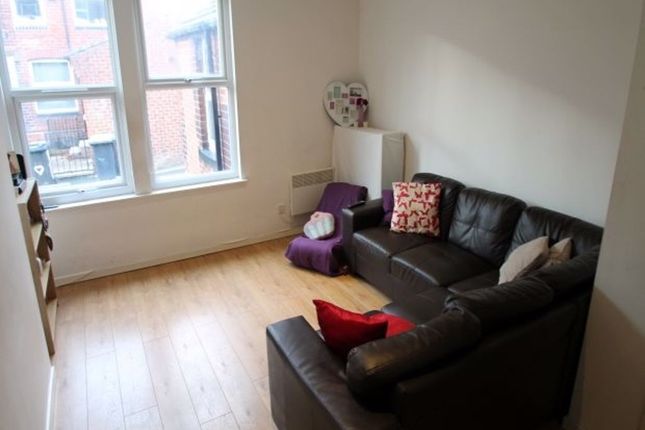 A Cozy, Well-Maintained Living Room Featuring A Da...