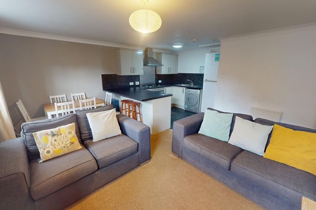 A Spacious And Modern Living Room Perfect For Soci...