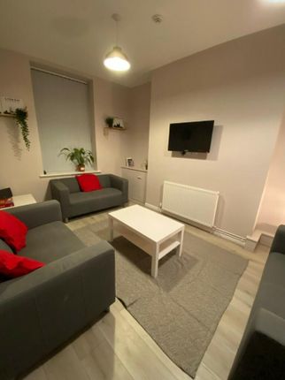 A Cozy And Inviting Living Room, Perfect For Socia...
