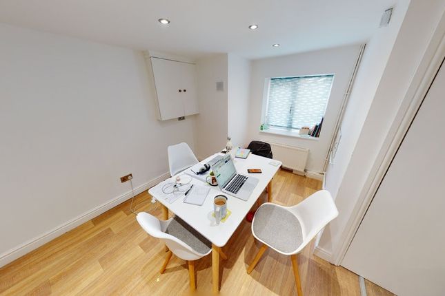 Bright And Modern Living Room Featuring Ample Natu...