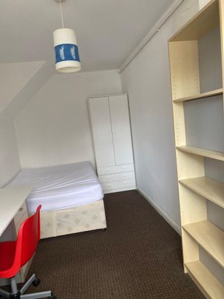 A Bright And Tidy Double Bedroom Featuring A Comfo...