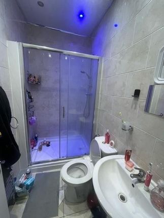 A Clean And Modern Bathroom With A Large Shower En...