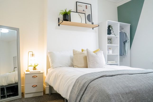 A Bright And Inviting Double Bedroom Featuring Sty...