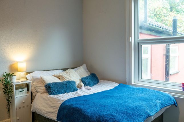 A Bright And Inviting Double Bedroom Featuring A S...