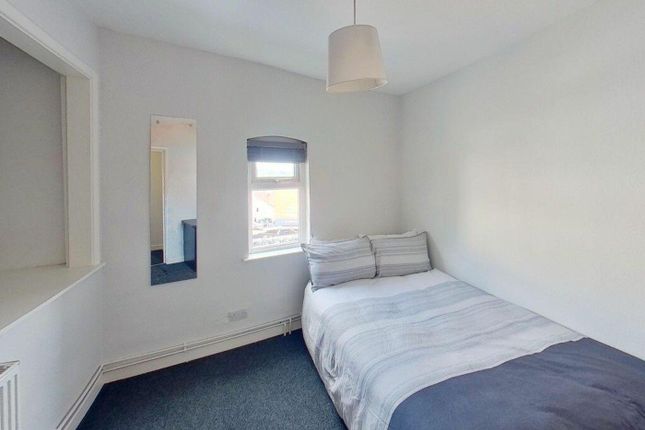 A Cozy Double Bedroom Featuring A Comfortable Bed ...