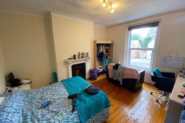 A Bright Double Bedroom Featuring Wooden Floors, A...