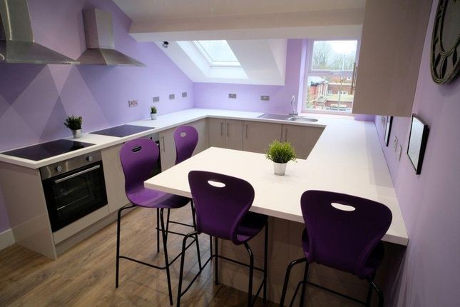 A Modern Kitchen Featuring A Sleek Electric Hob An...