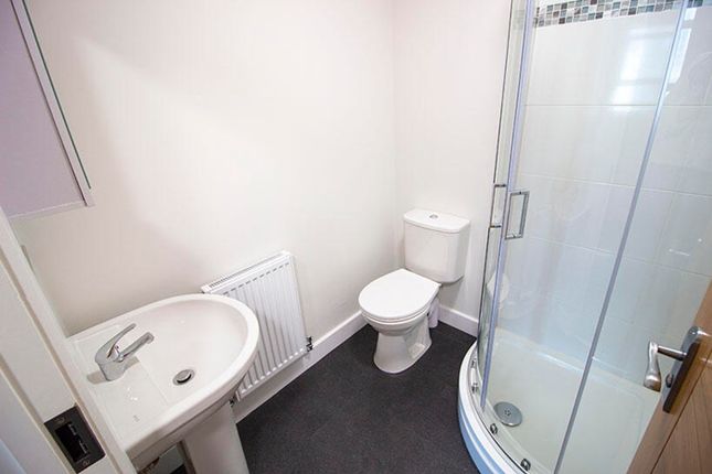 This Modern Bathroom Features A Spacious Shower An...