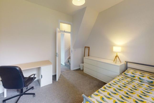 A Bright And Tidy Double Bedroom Featuring A Comfo...