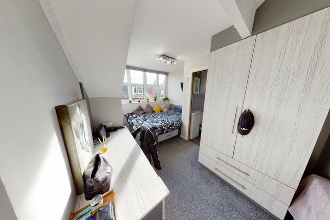 A Spacious And Well-Lit Master Bedroom Featuring A...