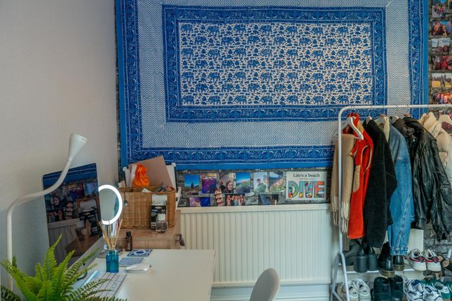 A Bright And Well-Maintained Bedroom Featuring A c...