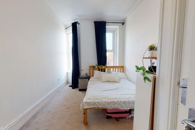 Cozy Double Bedroom Featuring A Comfortable Bed, A...