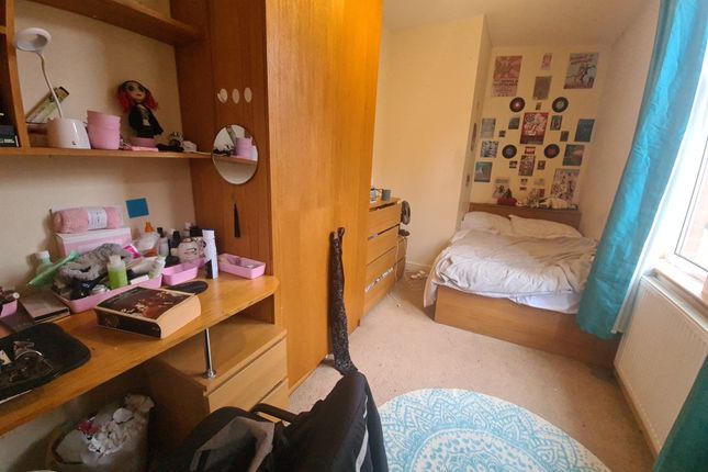 A Cozy And Well-Organized Single Bedroom Featuring...