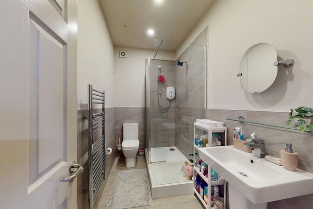 A Bright And Clean Bathroom Featuring Modern Fixtu...