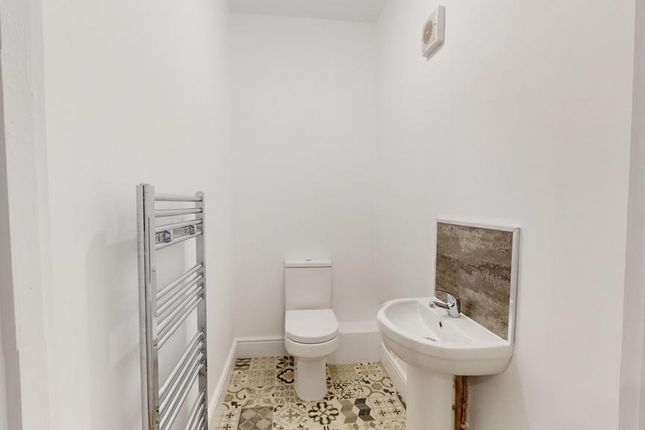 A Clean And Modern Single Toilet Space With Stylis...