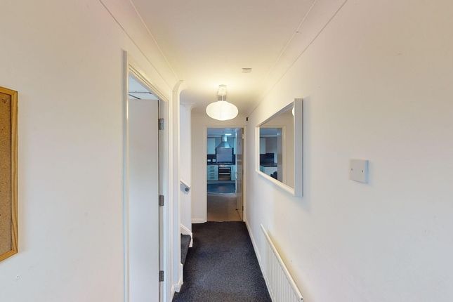 A Tidy Hallway With Ample Natural Light And A Welc...