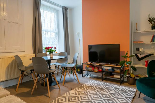 A Bright And Inviting Large Modern Living Room Wit...