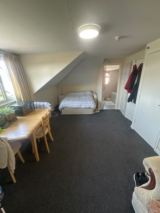 A Spacious Master Bedroom With A Cozy Double Bed P...