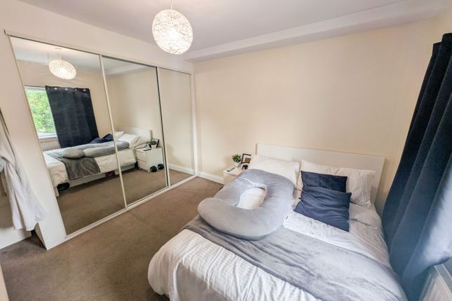 A Neat And Inviting Double Bedroom Featuring A Com...