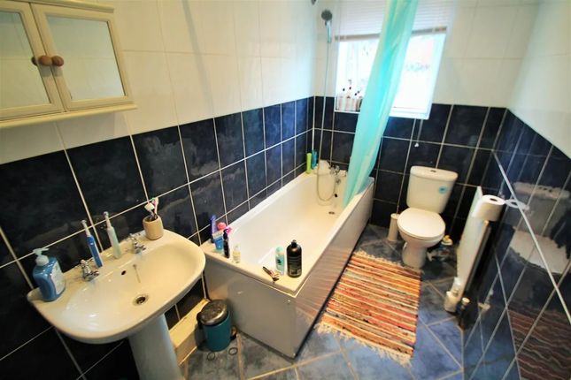 A Well-Maintained Bathroom Featuring A Bathtub Wit...