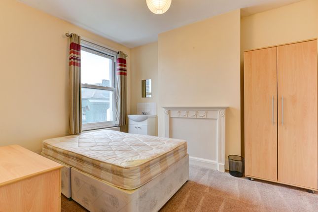 A Neatly Maintained Bedroom Featuring A Double Bed...