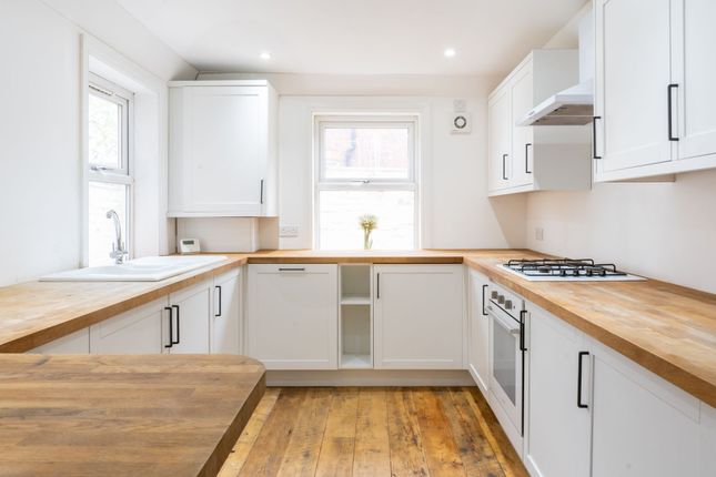 Bright And Modern Kitchen With White Cabinets, Woo...