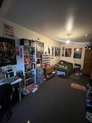 A Cozy Living Room Featuring A Comfortable Sofa, B...