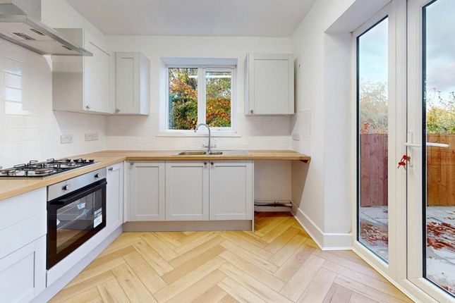 A Bright And Modern Kitchen With Ample Natural Lig...